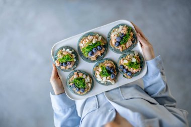 Homemade tasty appetizer on a blue pancakes.