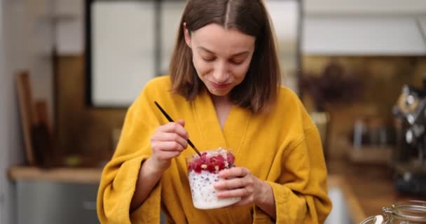 Hungry woman having a breakfast at home — Stock Video