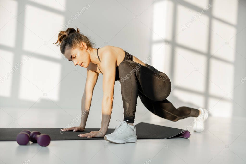 Woman doing cardio fitness indoors