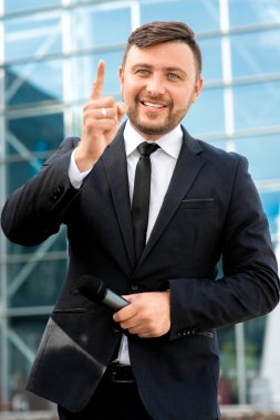 Portrait of well-dressed man on the contempopary background clipart