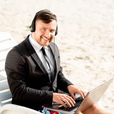 Businessman on the beach clipart