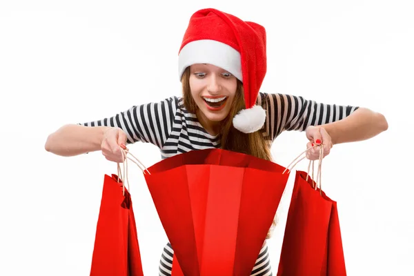 Mujer joven con bolsas de compras en Navidad —  Fotos de Stock