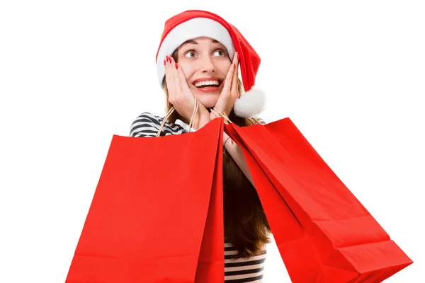 Mujer joven con bolsas de compras en Navidad —  Fotos de Stock