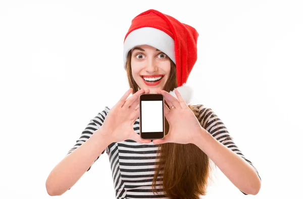 Jonge vrouw met mobiele telefoon op Kerstmis — Stockfoto