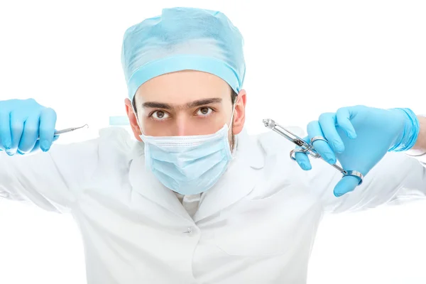 Dentista operando isolado em fundo branco — Fotografia de Stock