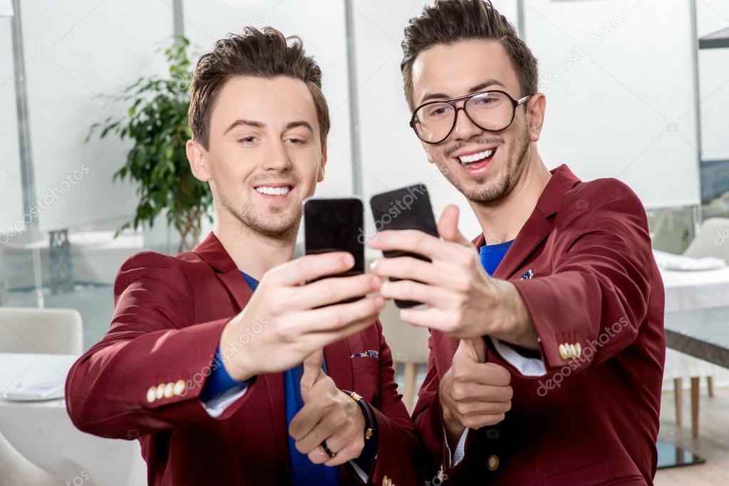 Brothers twins taking selfie photo