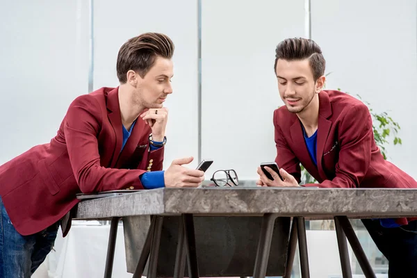 Two brothers twins working at the office — Stock Photo, Image