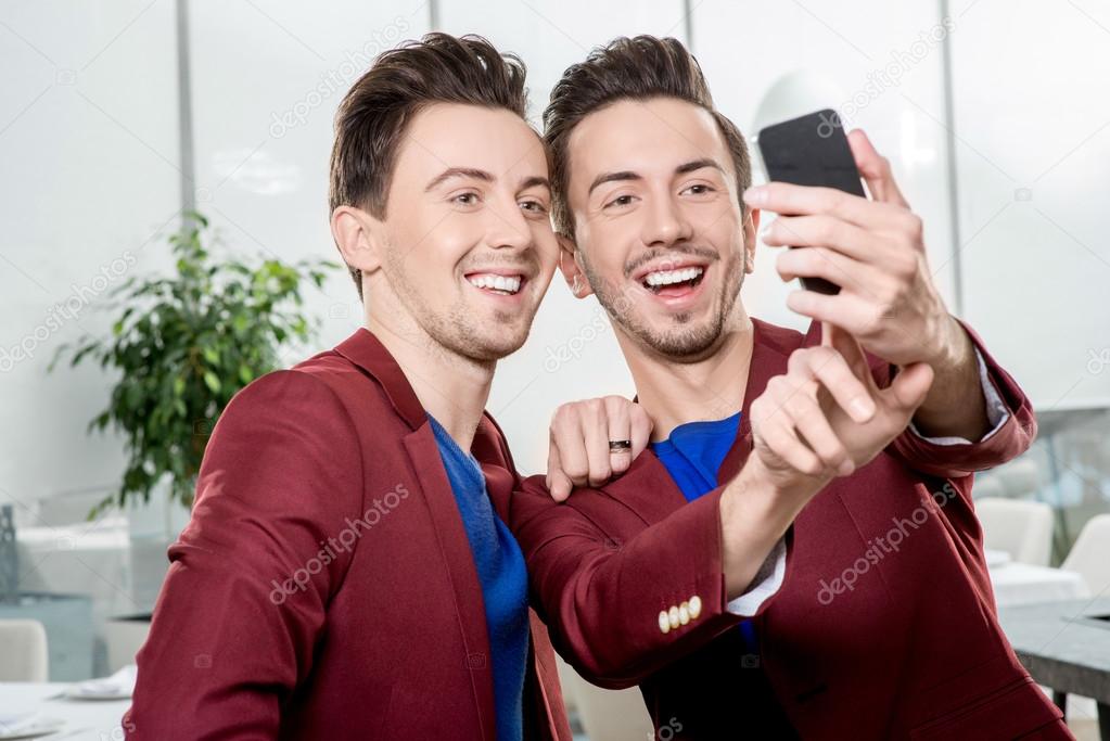 Brothers twins taking selfie photo