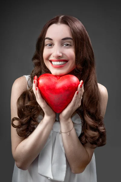 Woman with red heart — Stock Photo, Image