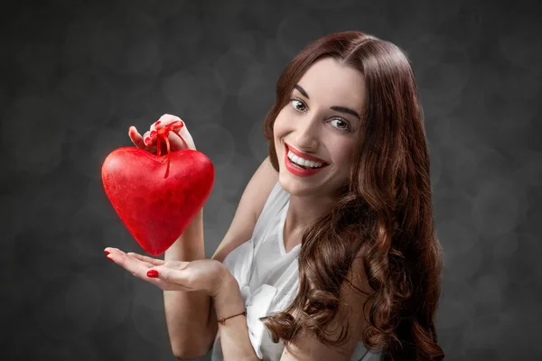 Woman with red heart — Stock Photo, Image