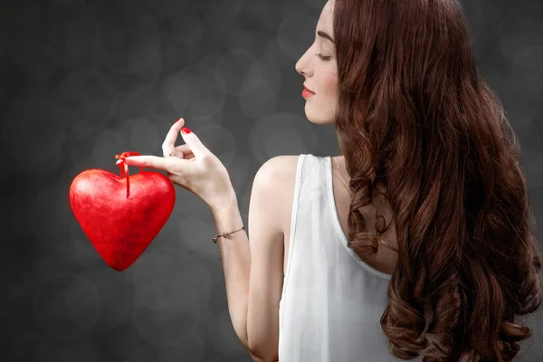 Woman with red heart — Stock Photo, Image