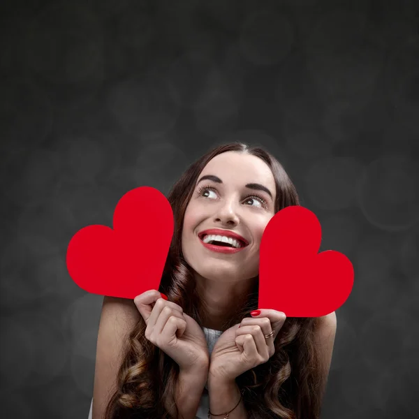 Woman with red hearts — Stock Photo, Image