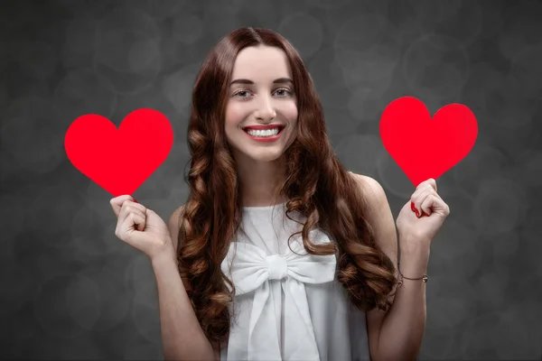 Woman with red hearts — Stock Photo, Image