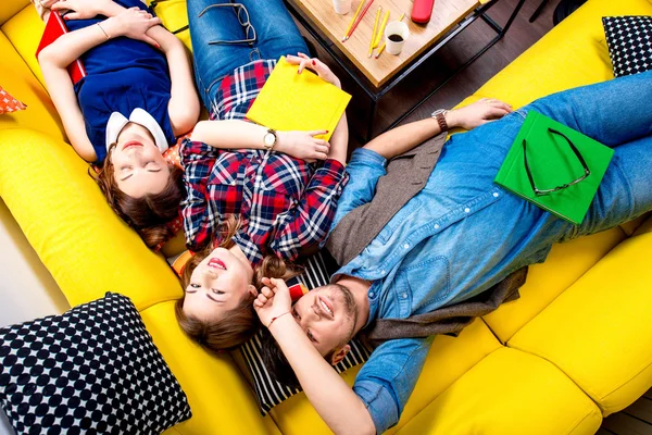 Sleeping and tired students on the couch — Stock Photo, Image