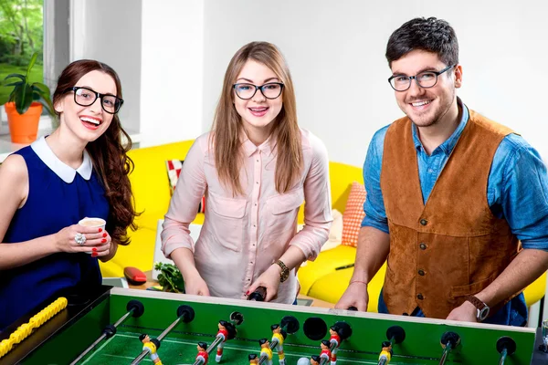 Friends playing table football — Stock Photo, Image