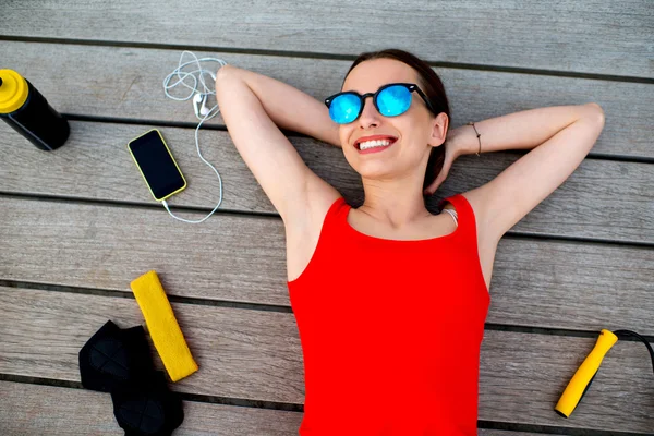 Sport woman on the sunbed — Stock Photo, Image