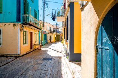 Street view with colorful old houses in Greece clipart