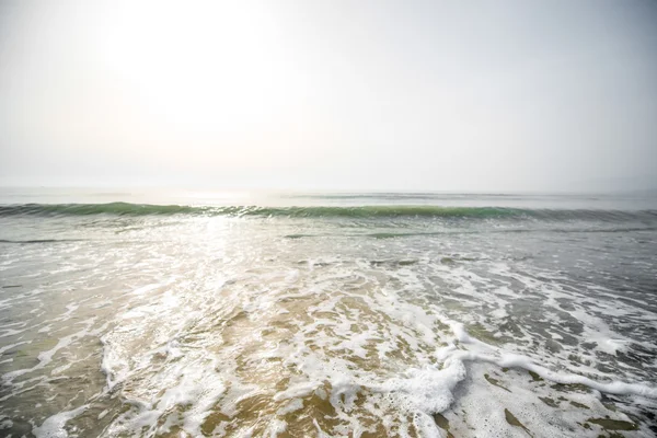 Foam waves on the beach — Stock Photo, Image