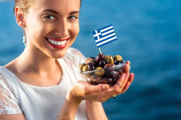 Woman holding greek olives — Stock Photo, Image
