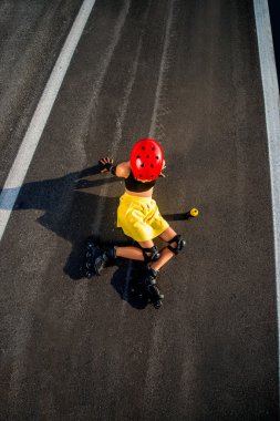 Sport woman with rollers on the highway