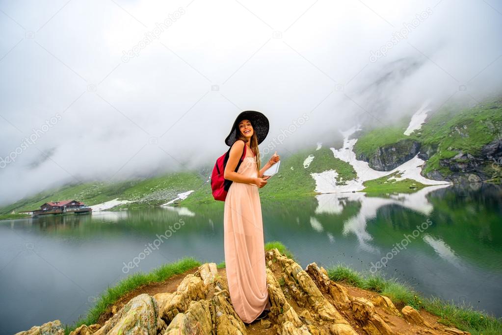 Traveler on the mountain lake