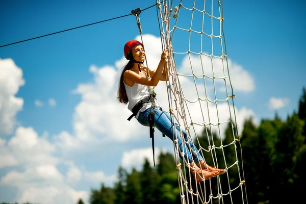 Riding on a zip line — Stock Photo, Image