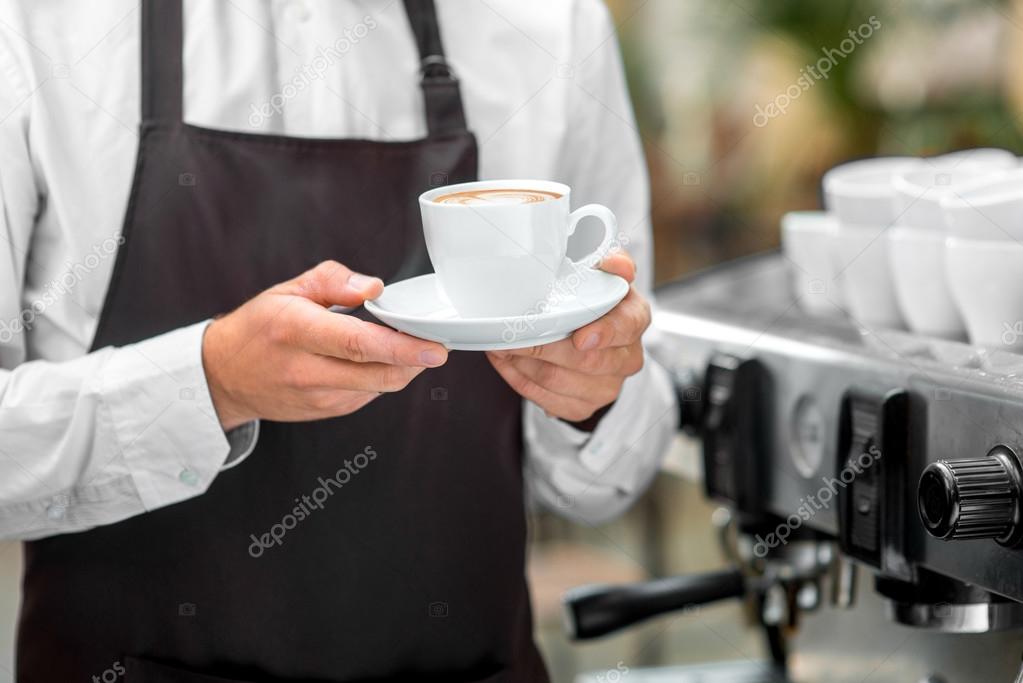 Holding coffee cup