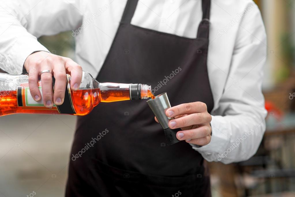 Barman pouring Aperol