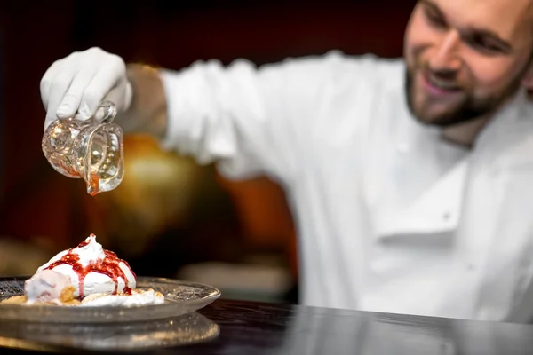 Chef cook serving dessert to the client — Stok fotoğraf