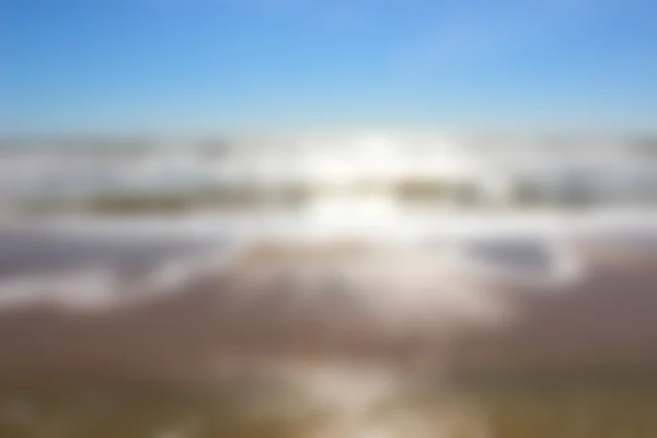 Blurred sea coast at sunrise