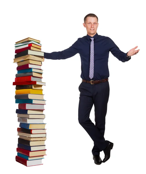Young man and big pile of books, on white — Stock Photo, Image