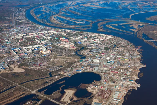 Aerial View of town on the bank river — Stock Photo, Image