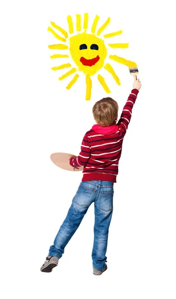 Young artist paints sun — Fotografie, imagine de stoc