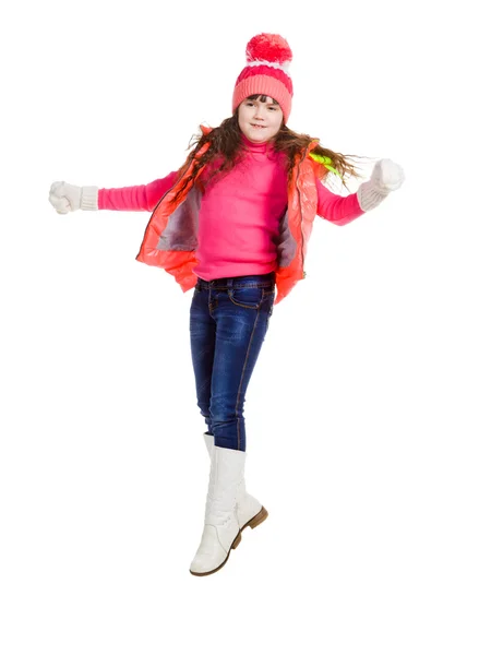 Jumping girl in winter clothes, on white — Stock Photo, Image