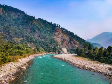 river flowing with mountain background image is taken at sikkim india.