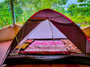 camping tent pitched at outdoor for adventure activity image is showing the outdoor adventure activity.