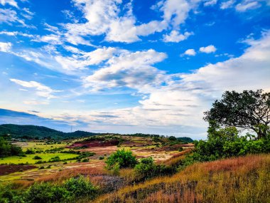 mountain side view with bright blue sky from flat angle in day image is showing the beautiful nature.