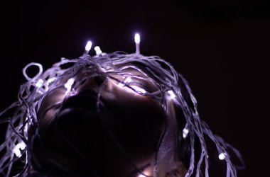 young girl facial expression posing with fairly light close up shot from different perspective