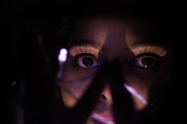 young girl facial expression posing with fairly light close up shot from different perspective