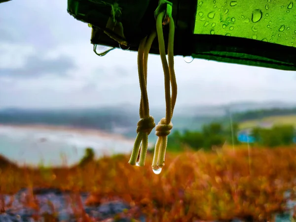 rain drops from camping ten with mountain veiw