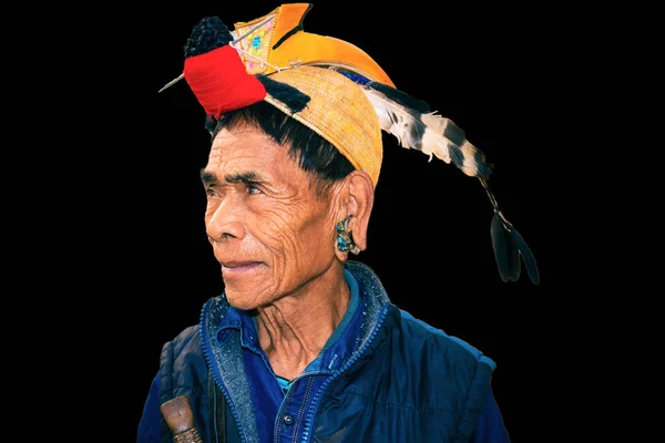 apatani tribal men facial expression with his traditional hat from flat angle image is taken at ziro arunachal pradesh india. it is one of the oldest tribe of india.