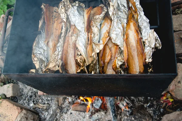 Smoked fish on fire