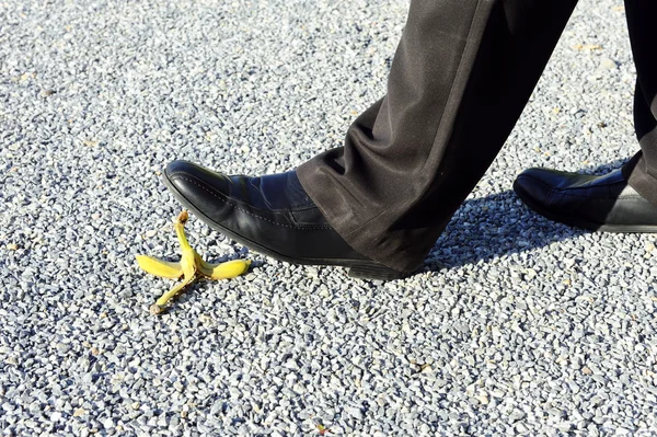 Business man en banana peel — Stockfoto