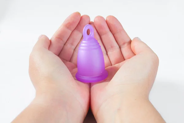 Woman hands with standing menstrual cup — Stock Photo, Image