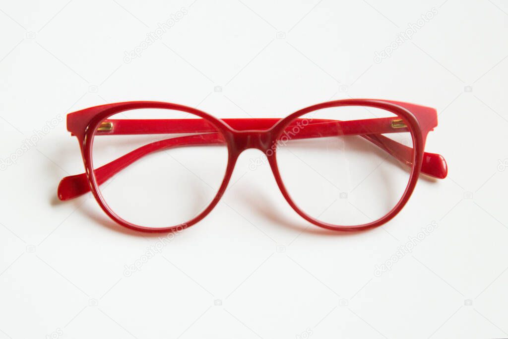 red glasses on white background