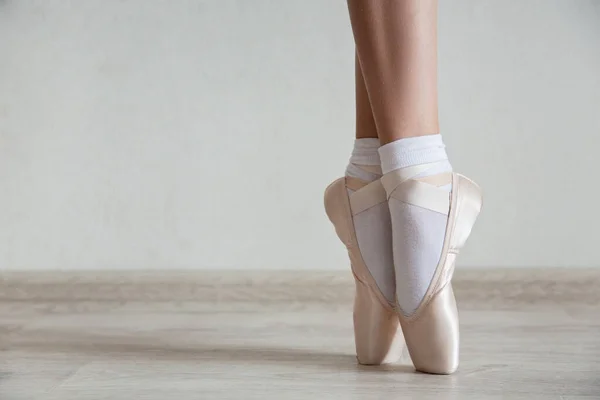 Ballerina feet in ballet shoes, close up