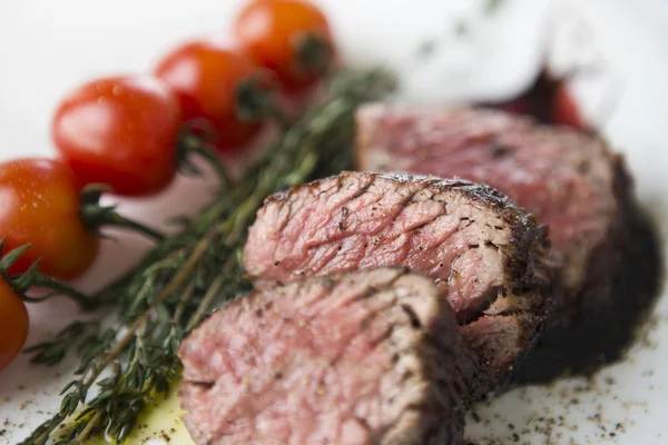 Rare cut steak with rosemary