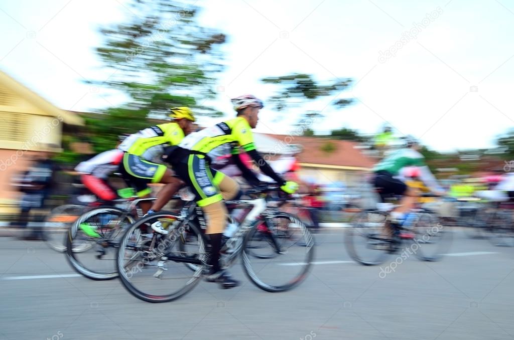 Motion blur of a group of cyclists in action during a cycling tour