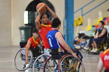 KUANTAN - DECEMBER 10: unidentified basketball athletes (male) in action during training for Paralympic Games on December 10, 2012 in Kuantan, Pahang, Malaysia.