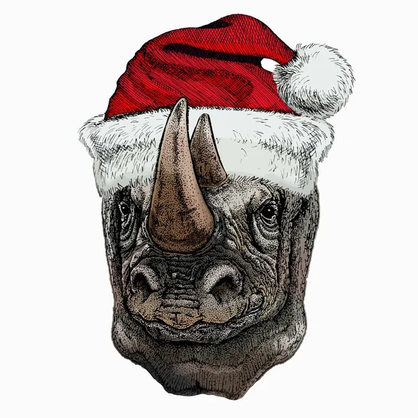Vectorportret van neushoorn, neushoorn. Kerst rode Kerstman hoed. Wild Afrikaans dier. — Stockvector